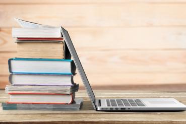 stack-books-with-laptop-wooden-table(1).jpg